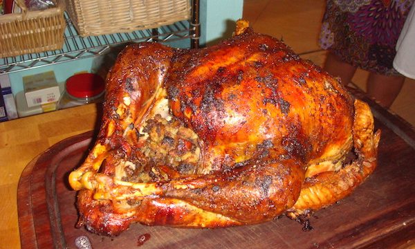 Golden Brown turkey o a wood cutting board