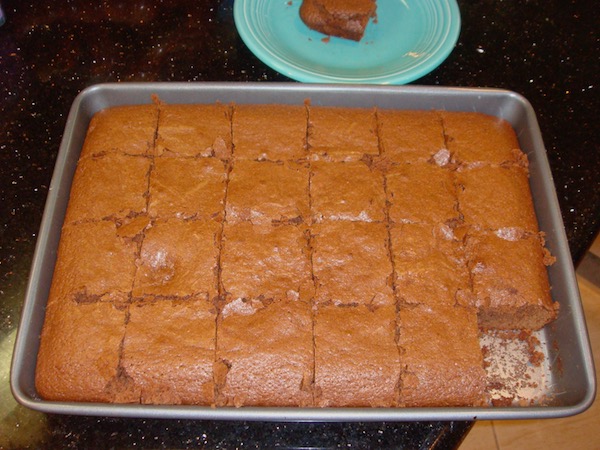 sheet pan of brownies with one square missing