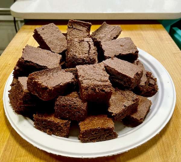 A white plate piled high with RhoRho's Brownies