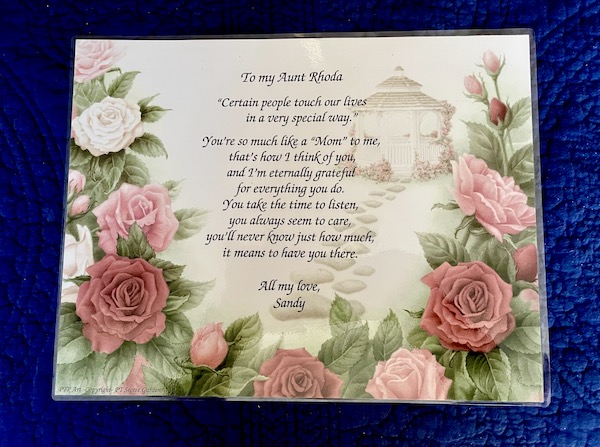 A card with roses and a saying honoring my Aunt Rhoda.