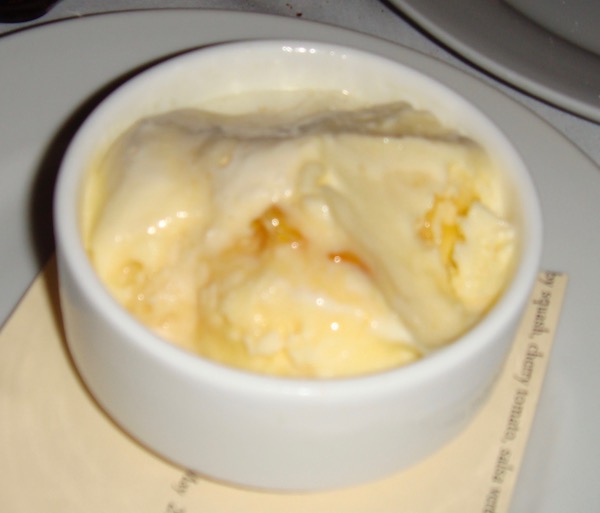 A white bowl filled with creme brulee ice cream.