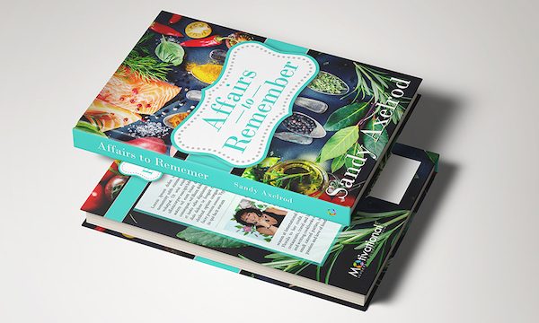 The front and back cover of a cookbook with colorful veg all over front.