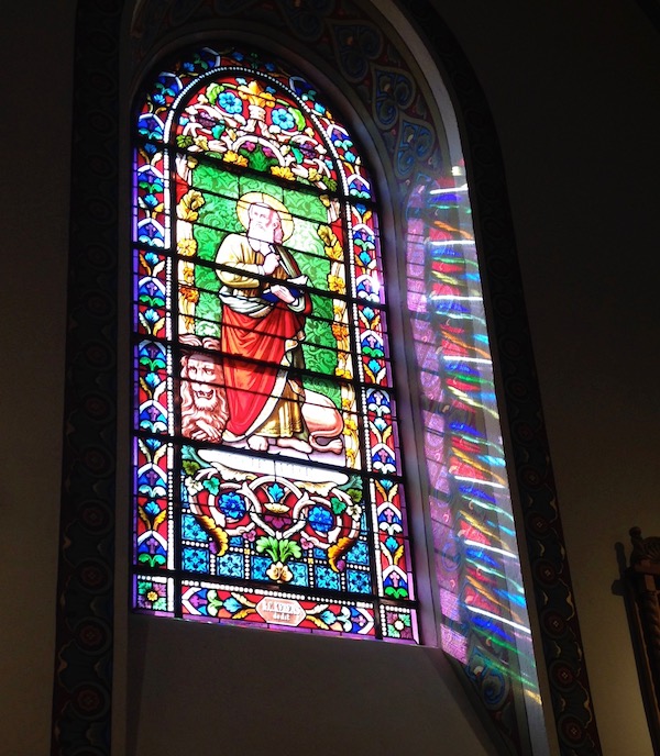 A colorful stained glass window in a church