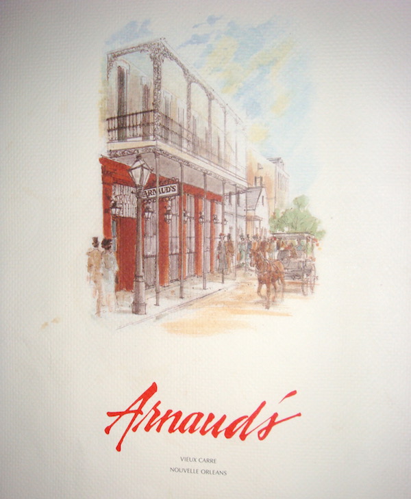 Menu cover with illustration of Arnaud's restaurant and the name Arnaud's written in red script below.