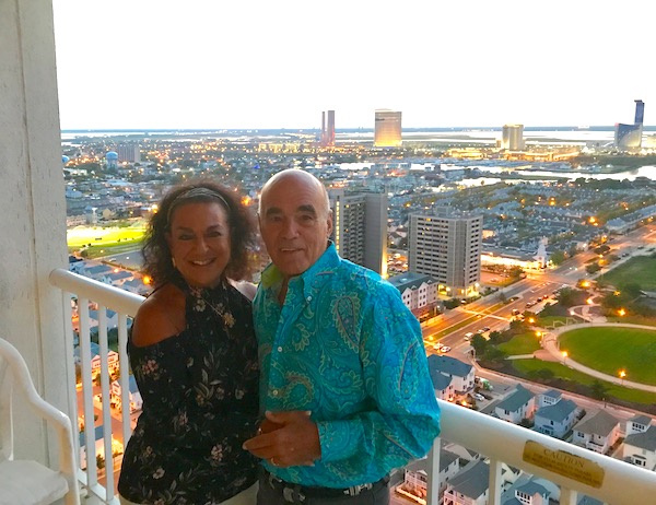 A man and a woman on a hotel balcony