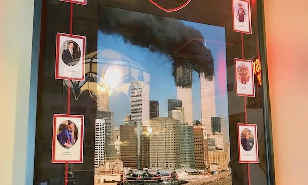 A framed photo of Photo of Twin Towers burning on 9/11