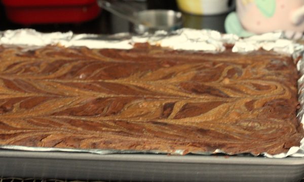 A foil lined pan of baked brownies