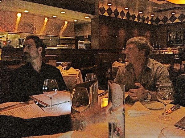 Two men at a restaurant.