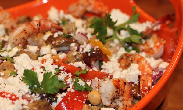 Grilled Eggplant and Chickpea Salad with Shrimp in a bright orange serving dish.