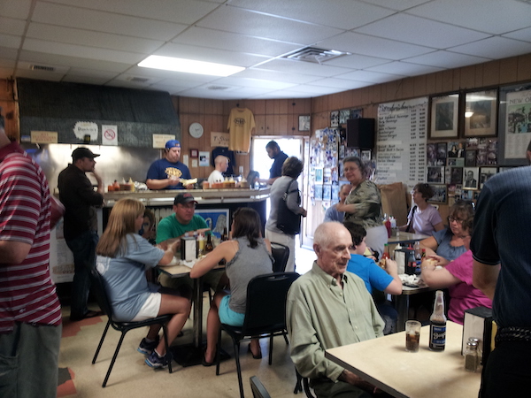 The inside of a small restaurant filled with people