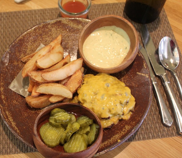 Deconstructed aka no bun Husk Cheeseburger on a brown plate
