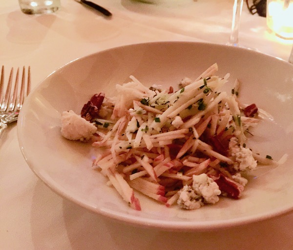 Match sticks of apple and celeriac piled high on a white dish