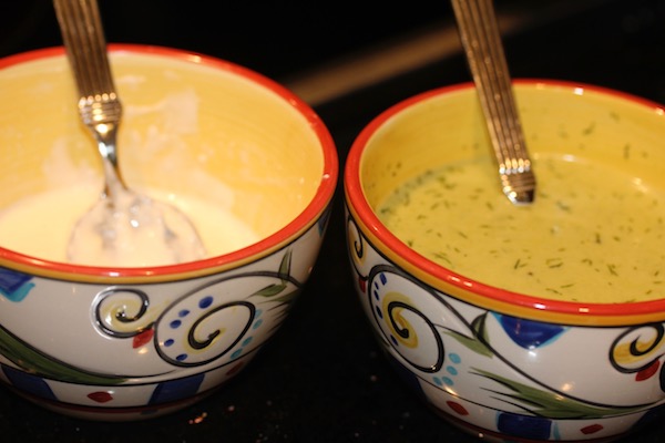 A pair of painted ceramic bowls filled with sauces