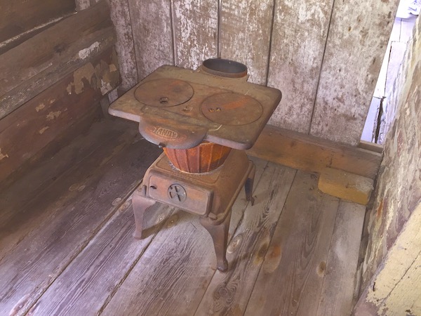 Inside a slave shack showing the stove