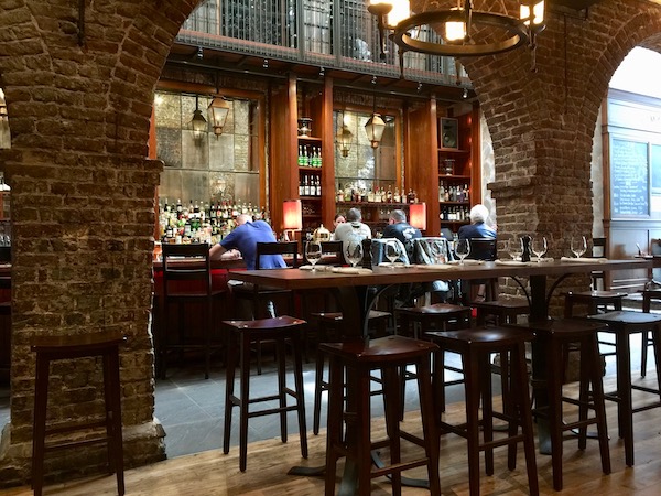 Bar at McCrady’s Tavern with brick walls and arches