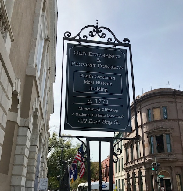 A sign between two buildings