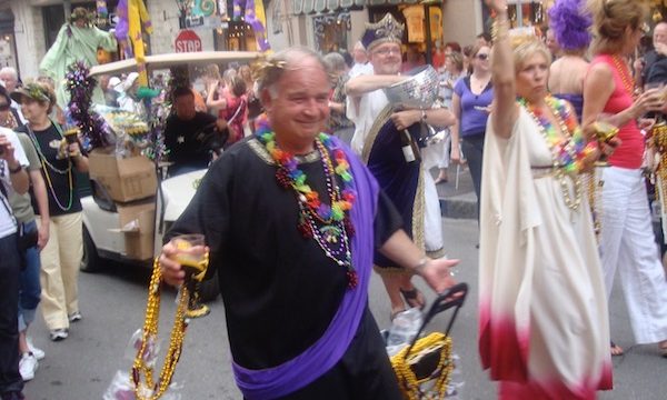 Men and women in togas celebrating life on the street