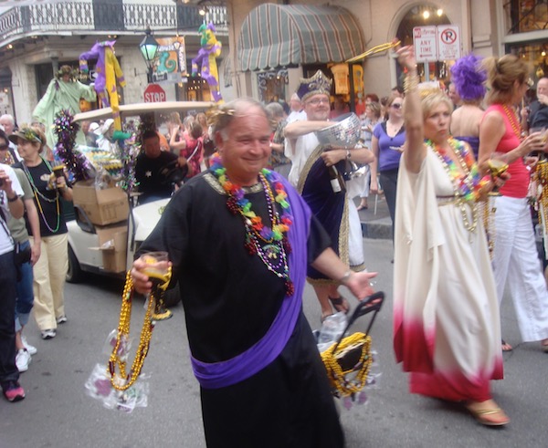 Men and women in togas celebrating life on the street