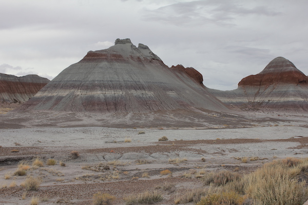 Multicolored striated mountains and desert.