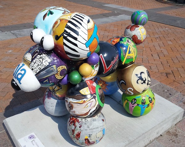 Side view of a colorful dog sculpture.