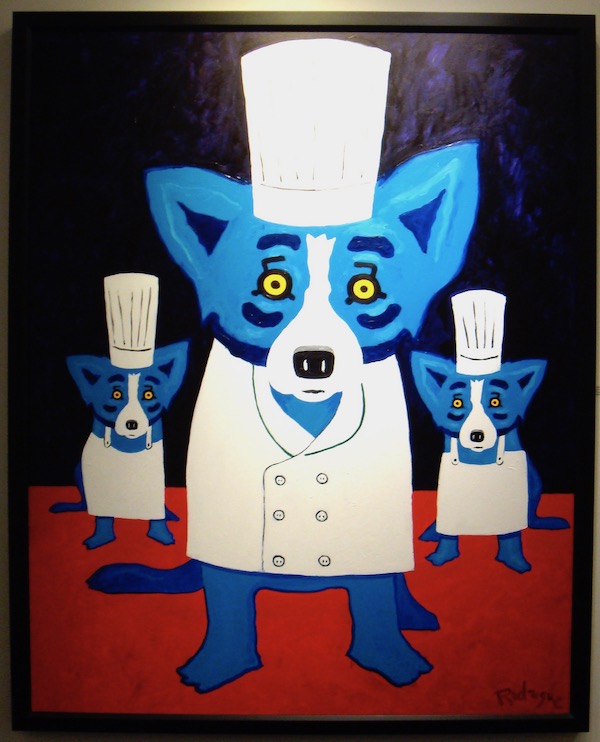A painting with three blue dogs dressed as chefs.