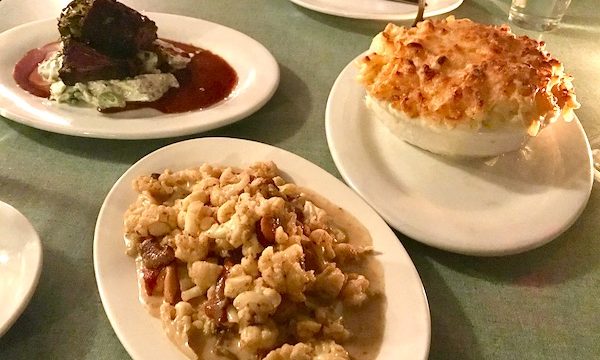 A trio of plates filled with food
