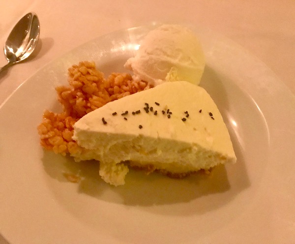 A slice of Key Lime Pie on a white plate.