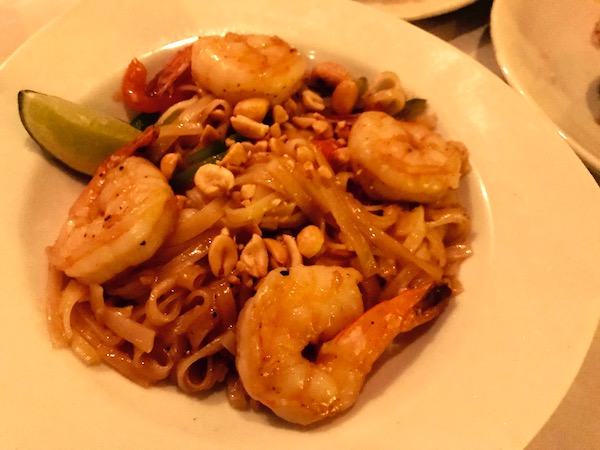 Shrimp Pad Thai on an ivory plate