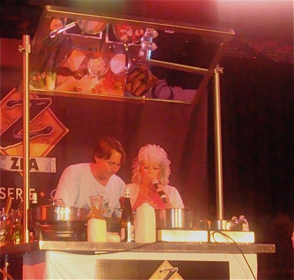 A male and a female chef doing a cooking demo