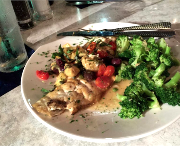 Tuscan Snapper Filet, colorful vegetables and broccoli on a white plate