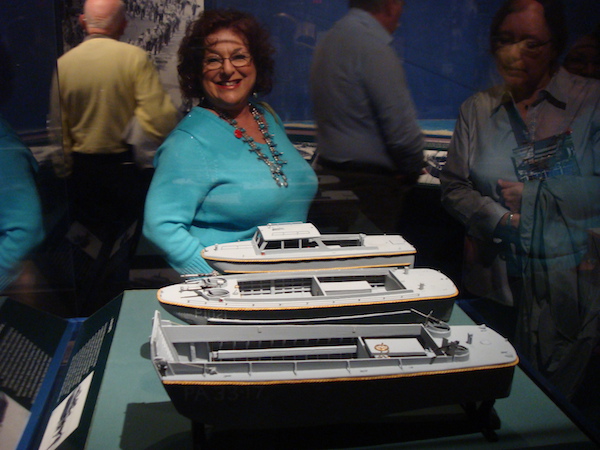 Sandy in turquoise sweater admiring the Model Boats at the National WWII Museum in New Orleans