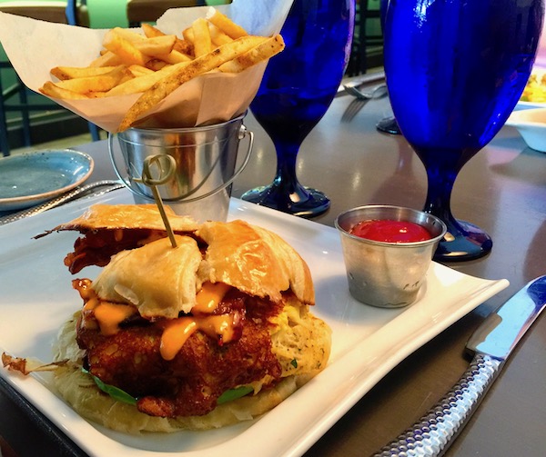 Crab Cake Sandwich and fries on a white square plate