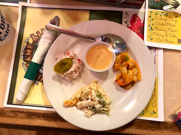 A white plate with several different menu items on it.