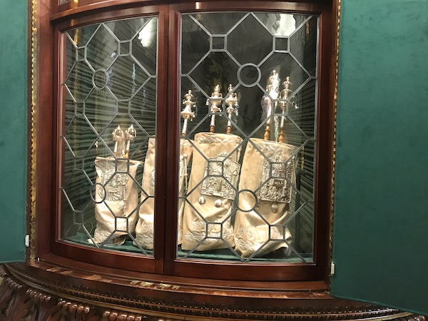 Torahs in a leaded glass and dark wood case