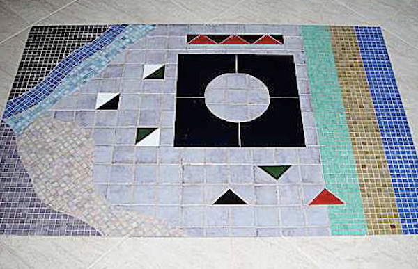A floor with a mosaic inset