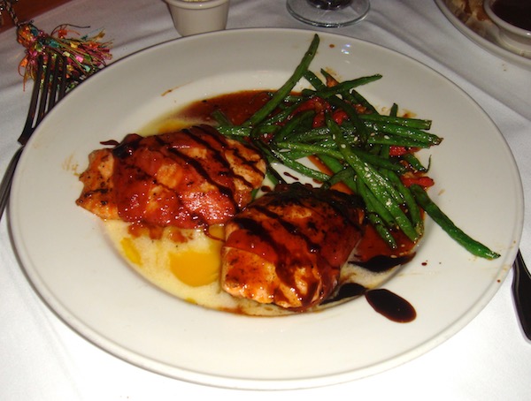 White dinner plate filled with miso glazed salmon filet and green beans