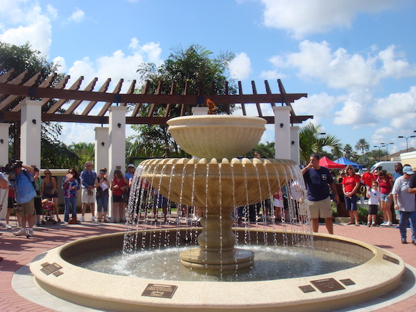 Reflecting Pool Fountain with Eternal Flame Glass Panels Under the Pergolas