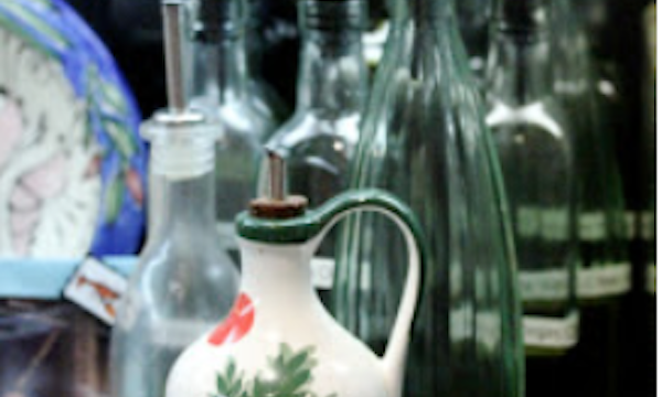 A grouping of assorted bottles of olive oils