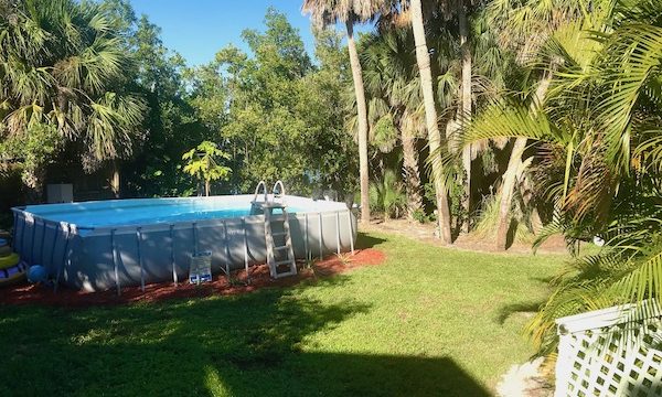 A very tropical landscape with an above ground pool at the Mellon Patch Inn on N. Hutchinson Island Florida.
