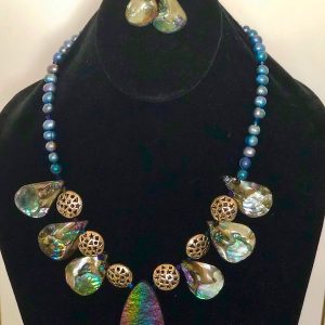 Abalone Freshwater Pearl and Pewter Necklace and Earrings on a black velvet display stand.