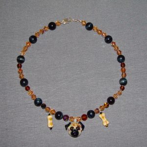 Onyx Swarovski Crystal and Glass Necklace on a gray background.