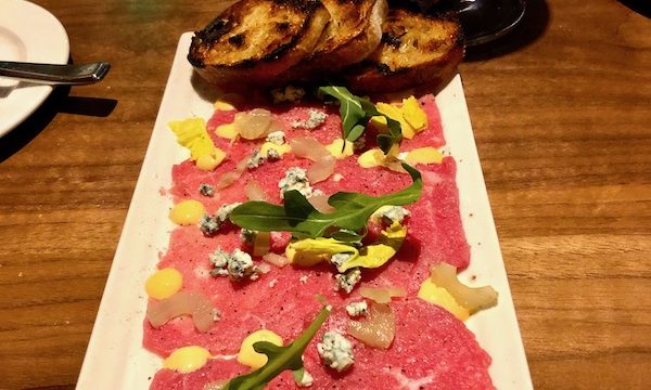 Zasu Restaurant in Mid City New Orleans offers a beautiful presentation of thinly sliced raw beef carpaccio.