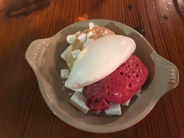 A bowl filled with light yellow, white and deep pink sorbets at Bywater American Bistro in New Orleans