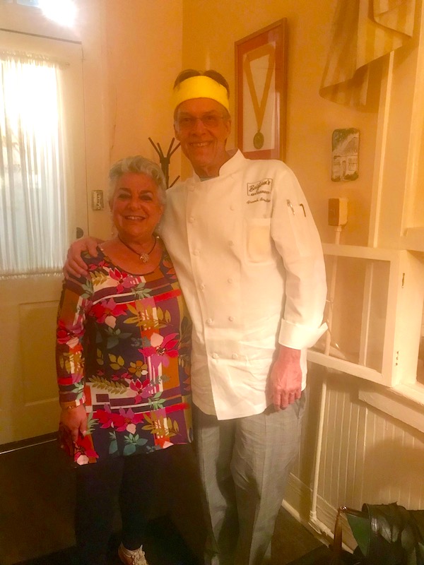 A very tall chef and a short woman with silver hair at Brigtsen's in New Orleans Revisited