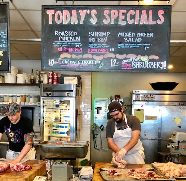 A butcher working where we had Lunch at Cochon Butcher in New Orleans