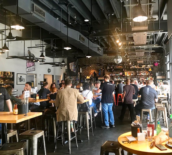 The main dining room and bar where we had Lunch at Cochon Butcher in New Orleans