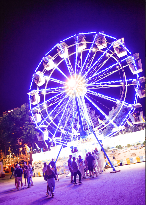 A large purple lit ferris wheel at Milwaukee's Summerfest 2019