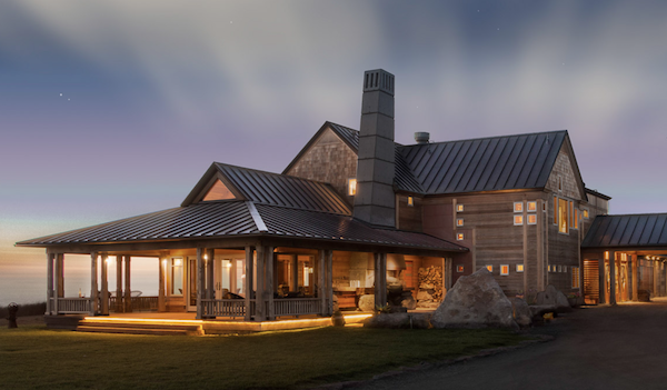A large brown wood inn at dusk from Spring in Mendocino, California
