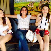 A mom flanked by two girls from Pink Steering Wheel Chronicles