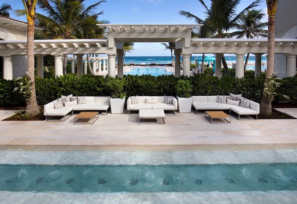A serene pool, lounges and loggia of a spa at The Breakers Palm Beach
